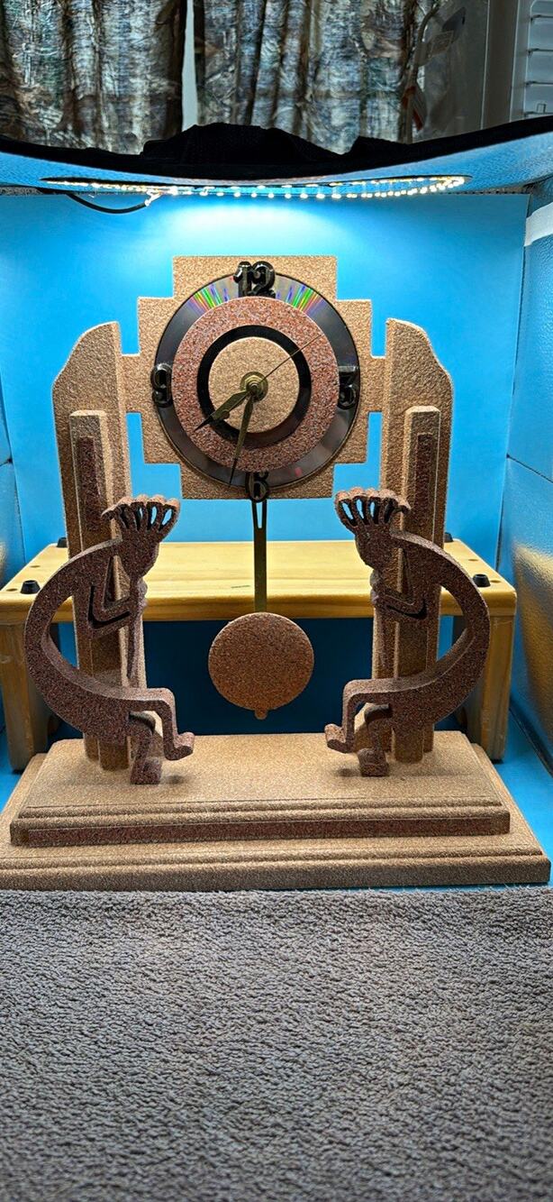 Kokopelli clock with Sand like finish Tera cotta color Quartz pendulum Battery